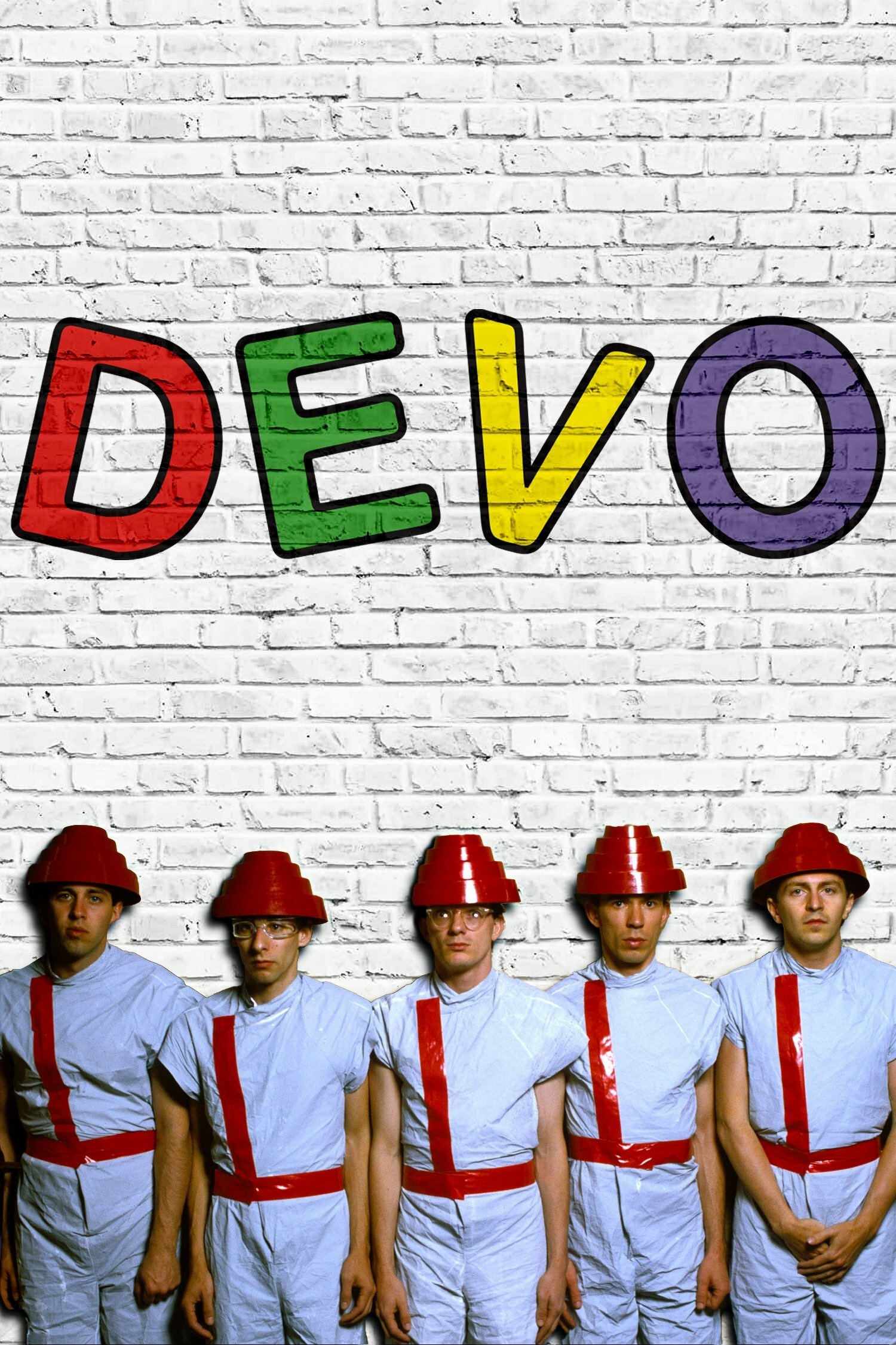 Five people standing in a line against a white brick wall. They are wearing matching light blue outfits with red diagonal stripes and red, tiered hats. Above them, the word "DEVO" is written in colorful letters on the wall.